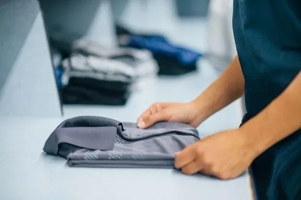 Laundry being folded on a counter